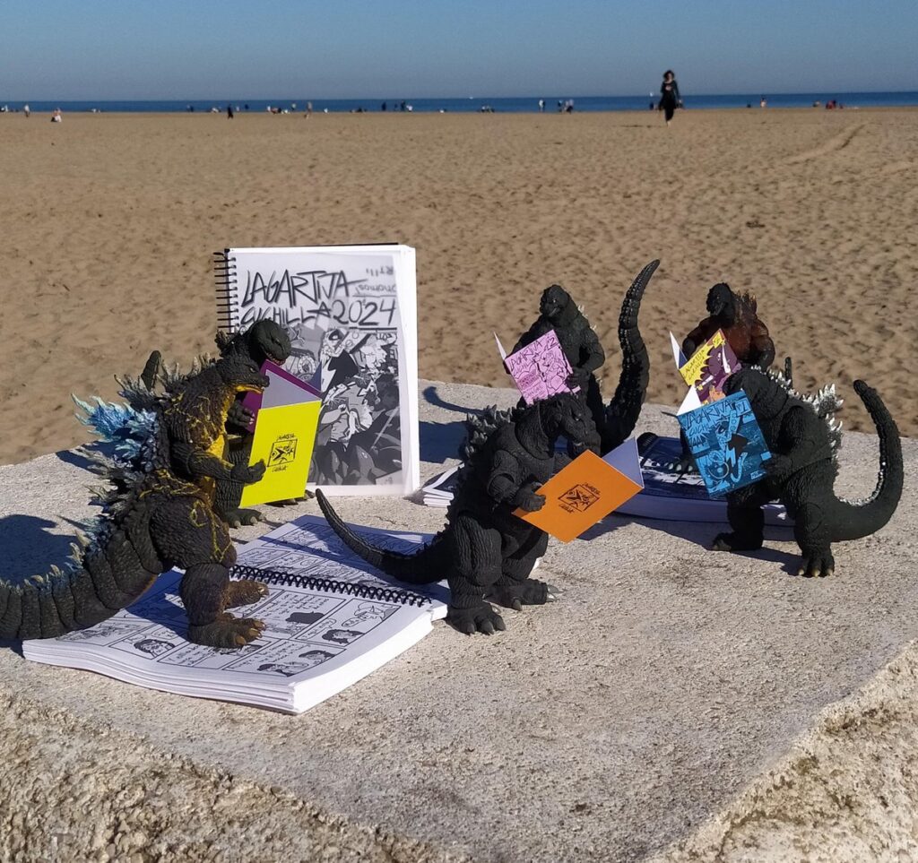 Muchos muñecos de acción de Godzilla, leyendo fanzines de Lagartija Cuchilla en la playa.